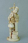 JAPANESE IVORY CARVING OF A CARPENTER