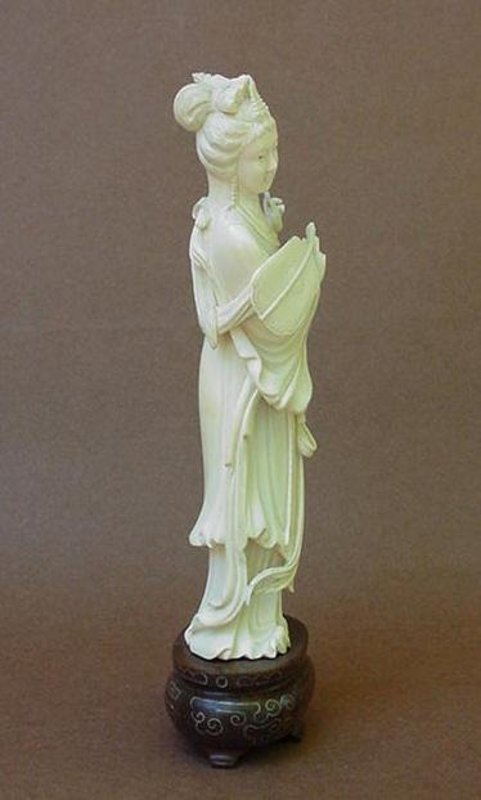 CHINESE CARVED IVORY BEAUTY HOLDING A FAN