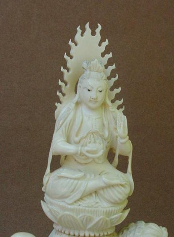 CHINESE CARVED IVORY BUDDHA WITH LION