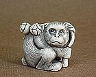 JAPANESE CARVED IVORY NETSUKE OF A MONKEY