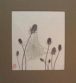 PAPER CUT-OUT OF A SPIDER WEB