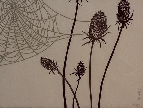 PAPER CUT-OUT OF A SPIDER WEB