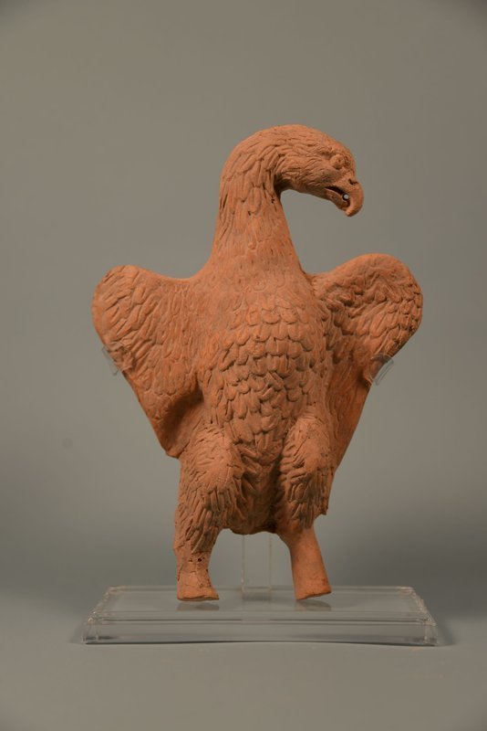 A ROMAN TERRACOTTA FIGURE OF AN EAGLE