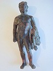 A ROMAN BRONZE FIGURE OF A YOUNG HERAKLES