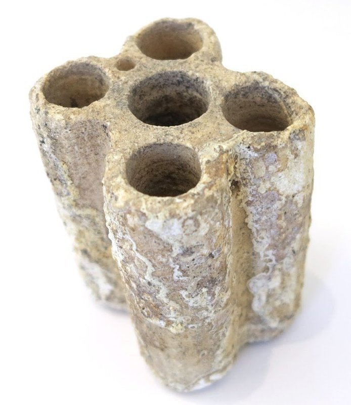 AN EGYPTIAN LIMESTONE QUINTUPLE KOHL TUBE