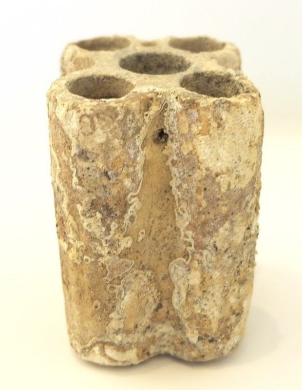 AN EGYPTIAN LIMESTONE QUINTUPLE KOHL TUBE