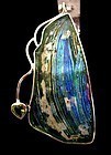 A ROMAN GLASS FRAGMENT IN SILVER PENDANT WITH HEART