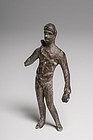 A ROMAN BRONZE FIGURE OF A YOUTH
