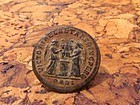 A ROMAN BRONZE FOLLIS OF CONSTANTINE I WITH OLIVE WOOD BOX