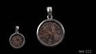 A COMMEMORATIVE BRONZE COIN OF THE FOUNDING OF ROME IN SILVER PENDANT