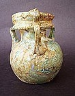 A ROMAN GLASS THREE HANDLED COSMETIC JAR