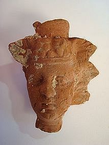 A HELLENISTIC EGYPTIAN TERRACOTTA HEAD OF DIONYSOS