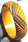 DEEPLY CARVED YELLOW BAKELITE BANGLE