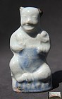 A RARE YUAN QINGBAI WITH BLUE AND BROWN IRON SPLASH BOY FIGURINE