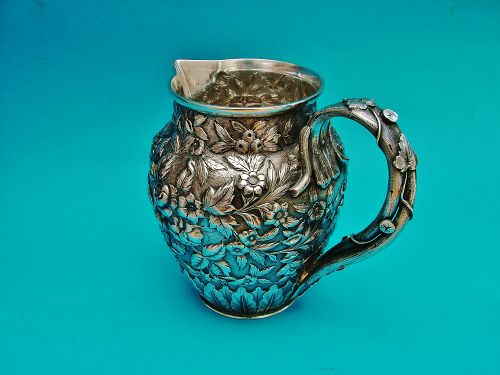 Peter Krider repoussé chased sterling bar pitcher,