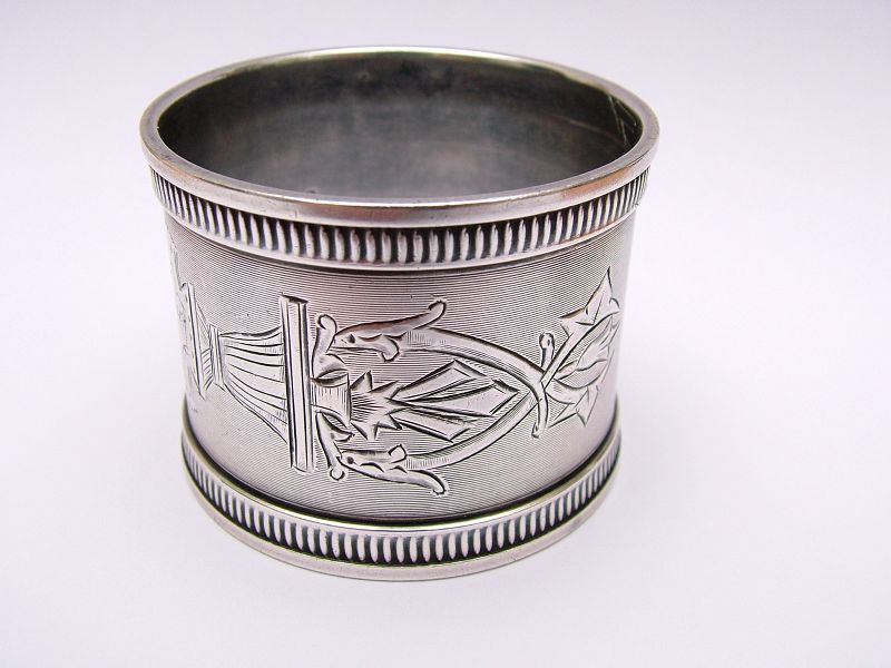 Thoroughly charming coin silver napkin ring,