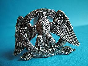 a good pair of Belgian Eagle motif silver knife rests,