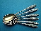 12 Antique, chased egg spoons with gilt matte finish