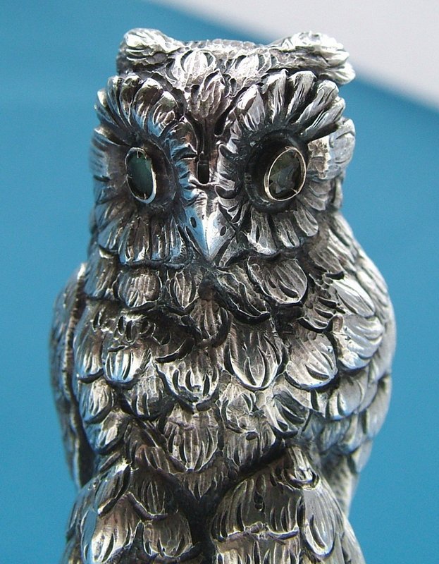 a fine full figural owl desk seal,  pale emerald eyes