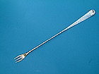 long, elegant spot-hammered olive fork