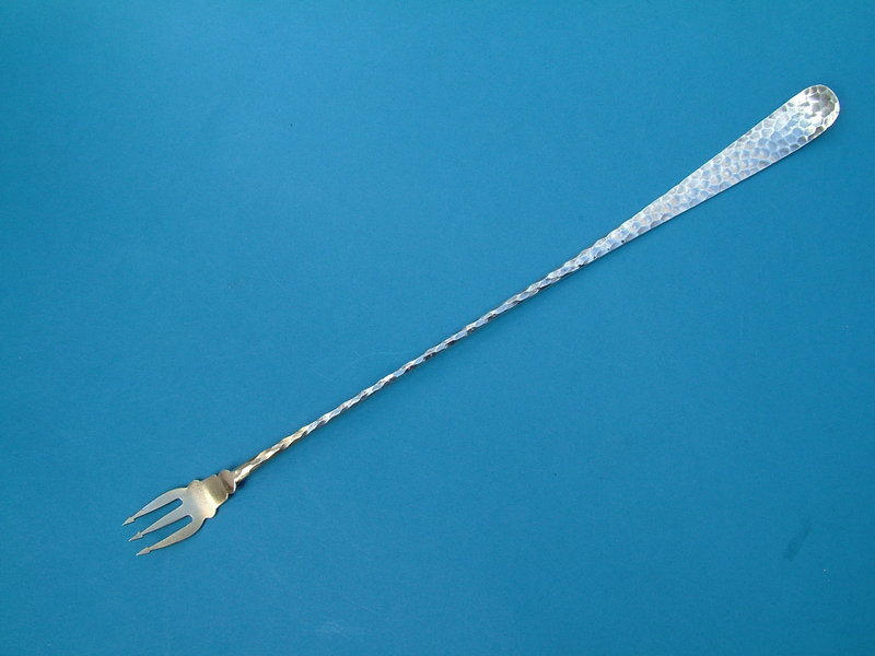 long, elegant spot-hammered olive fork