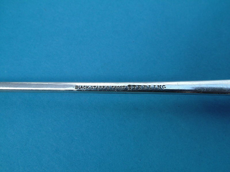 long, elegant spot-hammered olive fork
