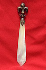 Bronze handled paper knife with mother-of-pearl blade