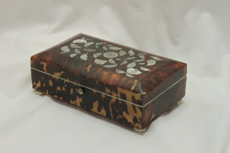 Tortoiseshell trinket box inlaid with silver and mother-of-pearl