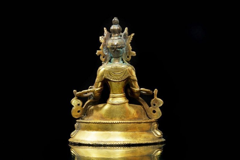 SINO-TIBETAN GILT BRONZE SEATED BUDDHA, 19th C.