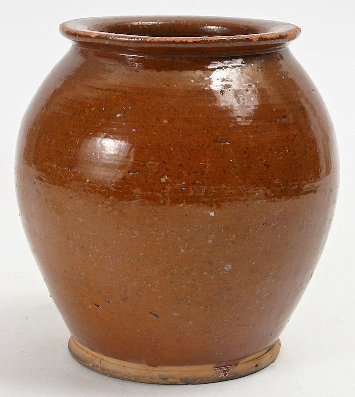 Antique Redware pottery ovoid jar in brown glaze