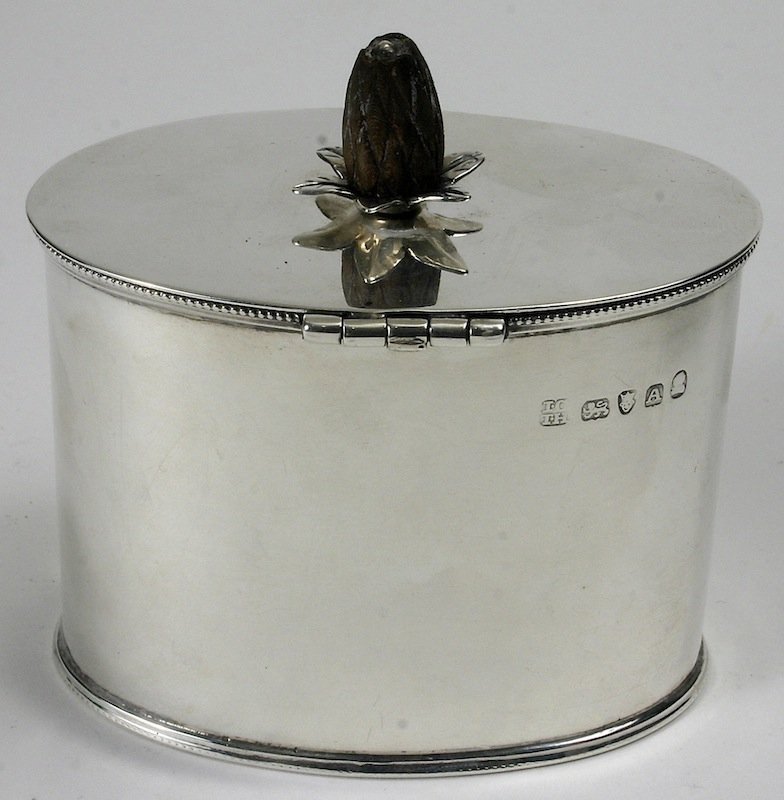 Georgian sterling silver oval tea caddy with pineapple finial, 1796