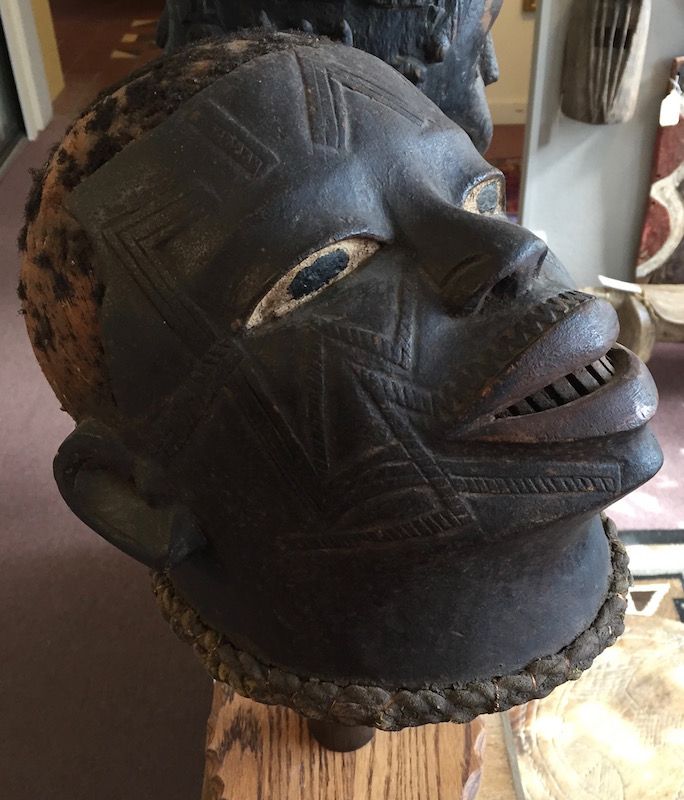 African carved helmet mask of a human head - Makonde