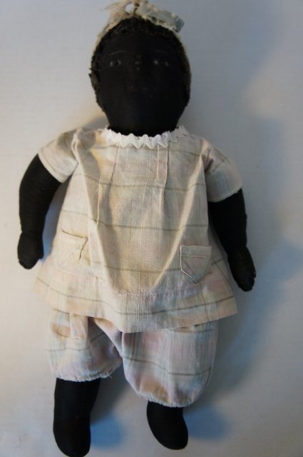 Black cloth antique baby doll unusual to find early nice