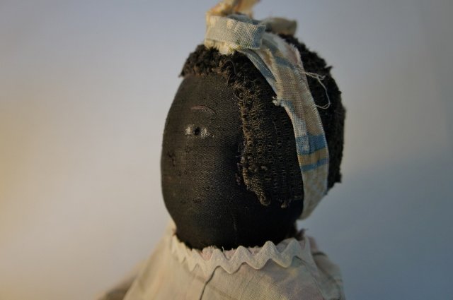 Black cloth antique baby doll unusual to find early nice