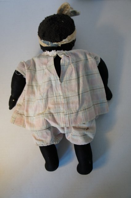 Black cloth antique baby doll unusual to find early nice