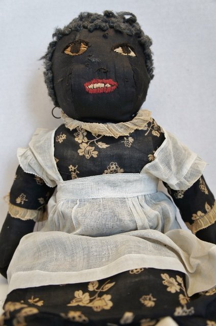 All original antique black cloth doll with great clothes