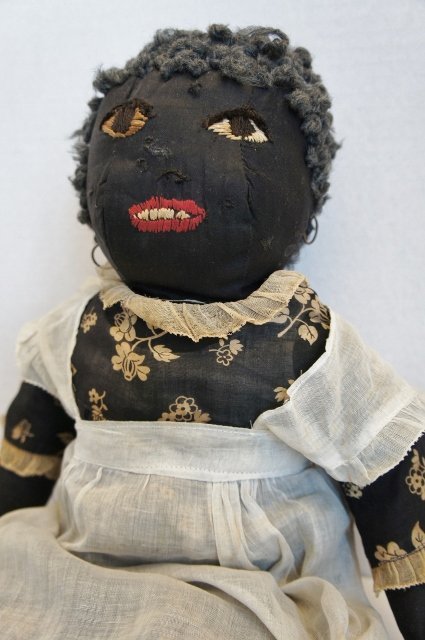 All original antique black cloth doll with great clothes