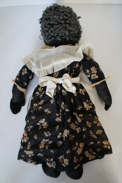 All original antique black cloth doll with great clothes