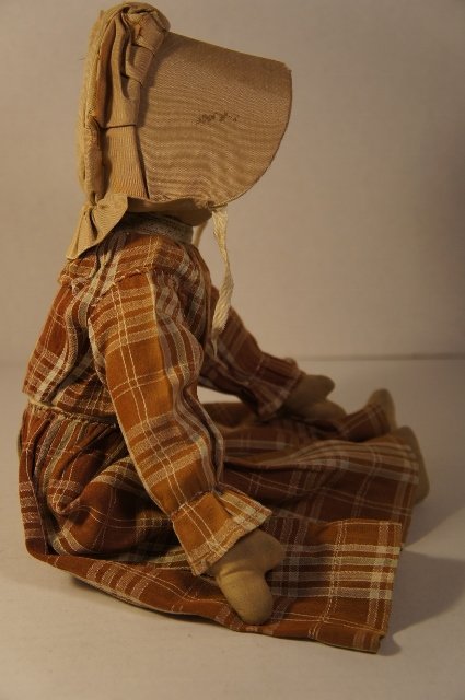 Pencil face prairie type cloth doll brown dress  tan bonnet antique