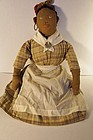 Antique embroidered face black cloth doll