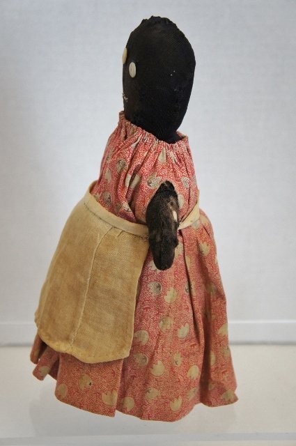 a plain and simple small black bottle doll door stop