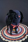 Antique spaniel dog with fur ears and red collar.