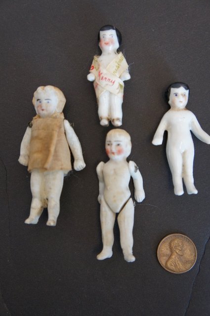 Lot 677: 27 Miniature China & Bisque Dolls w/ 3 Figures