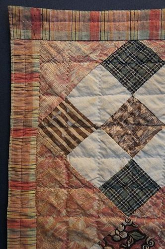 Nice early doll quilt from an even earlier full sized quilt chintz
