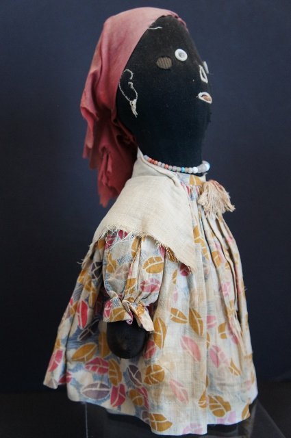 A great black bottle doll doorstop original clothes antique folk art