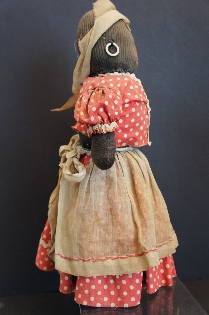 A large sad black bottle doll doorstop with a secret 15&quot; tall