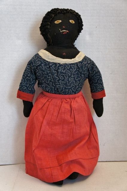 So nice black doll with golden brown eyes, blue calico dress 19th C.