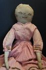 Antique cloth doll with sepia ink drawn face great early dress
