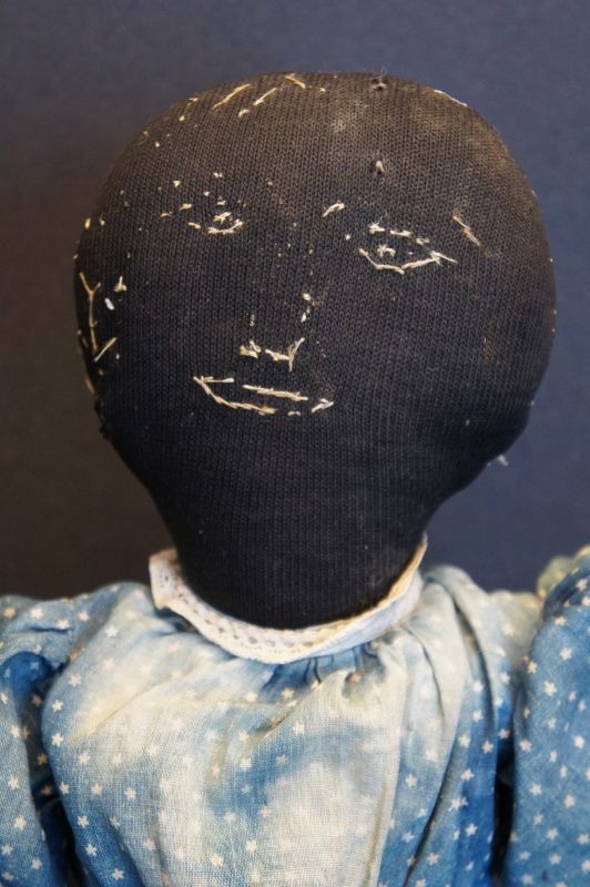 A special black cloth doll with embroidered face 21&quot; antique