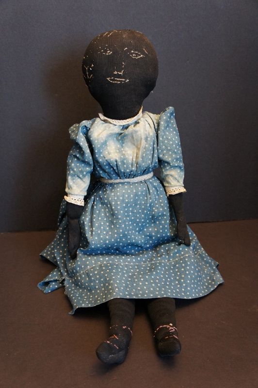 A special black cloth doll with embroidered face 21&quot; antique